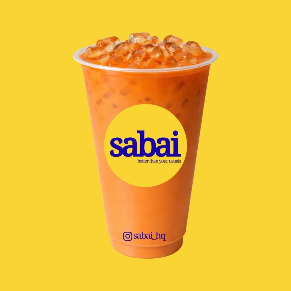 Mai Pen Rai Thai Red Milk Tea — sunshine yellow background, classic orange milk tea with chunky ice